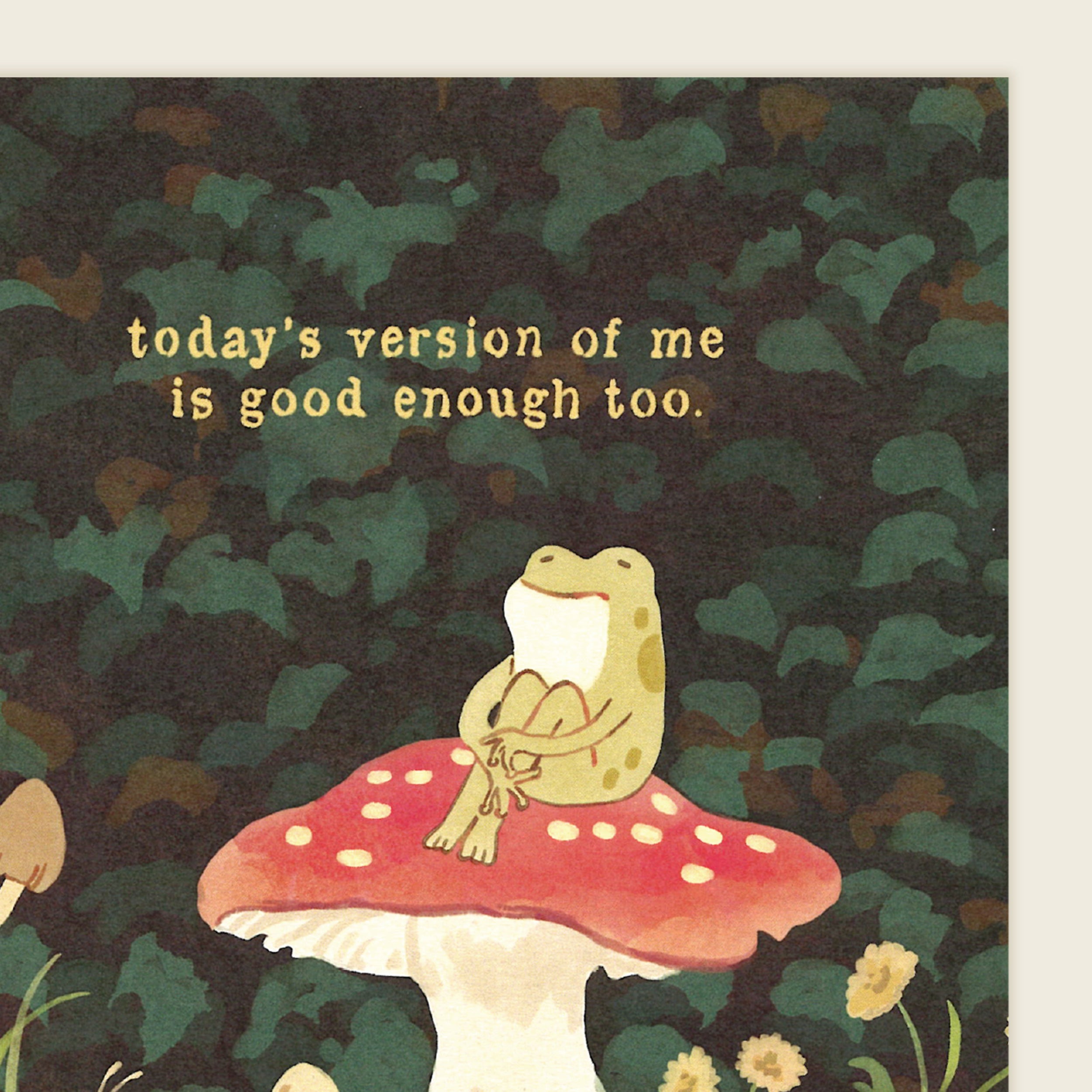 Frog sitting on a mushroom with a motivational quote against a leafy background